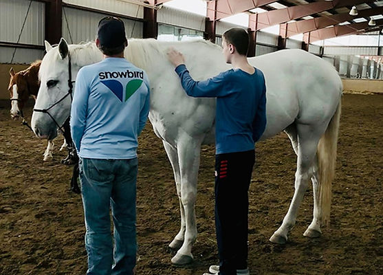 Two teenaged boys from our Just Say Whoa horse therapy group which is focused on underserved youth in the Boulder, Colorado community.