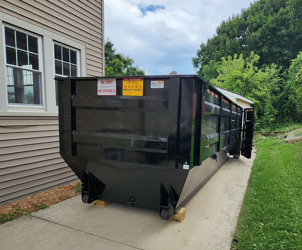 Black roll-off dumpster rental in Racine WI driveway