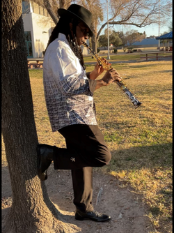 sax against the tree