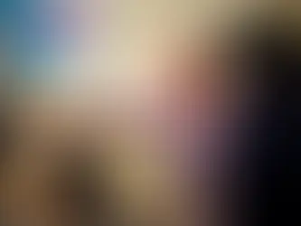 A Person pointing at a screen while a woman is watching the scene