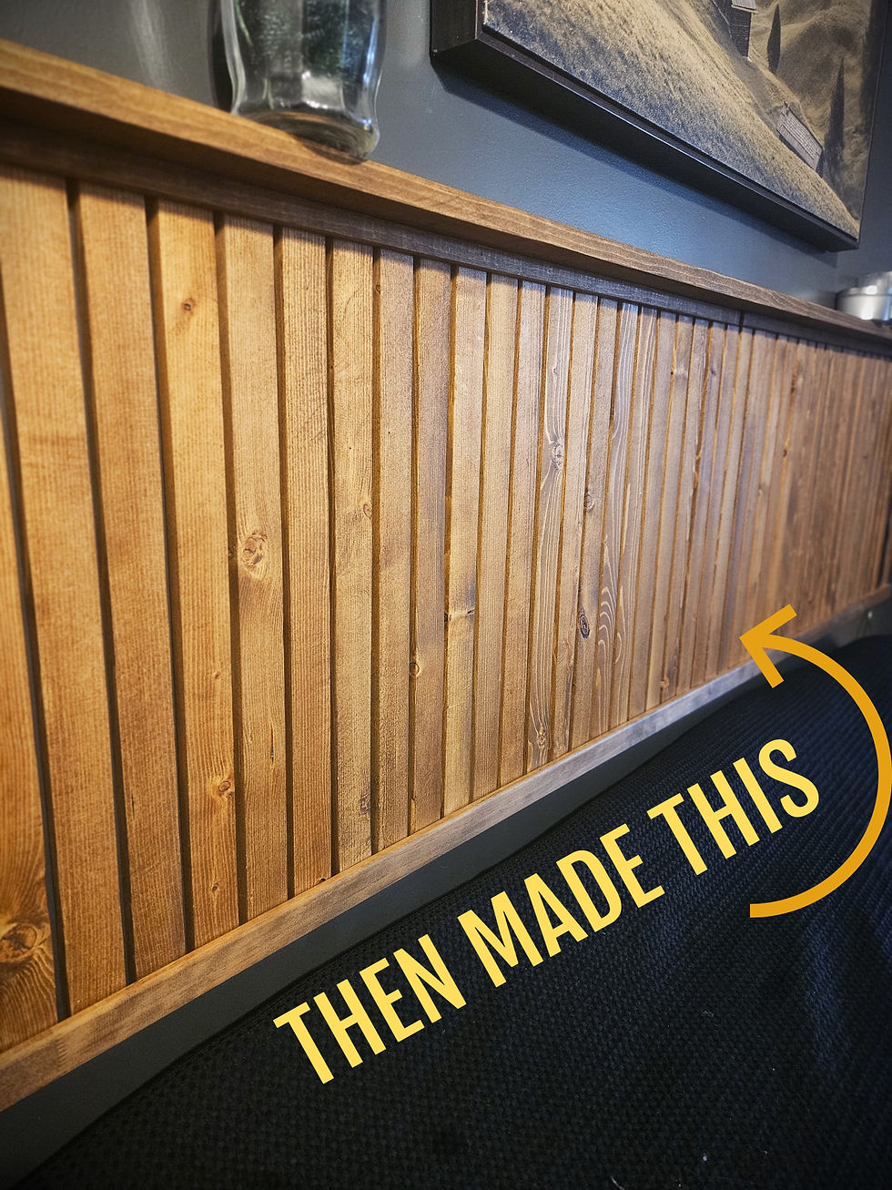 An after image of the DIY wood slat headboard with "then made this" pointing to it.