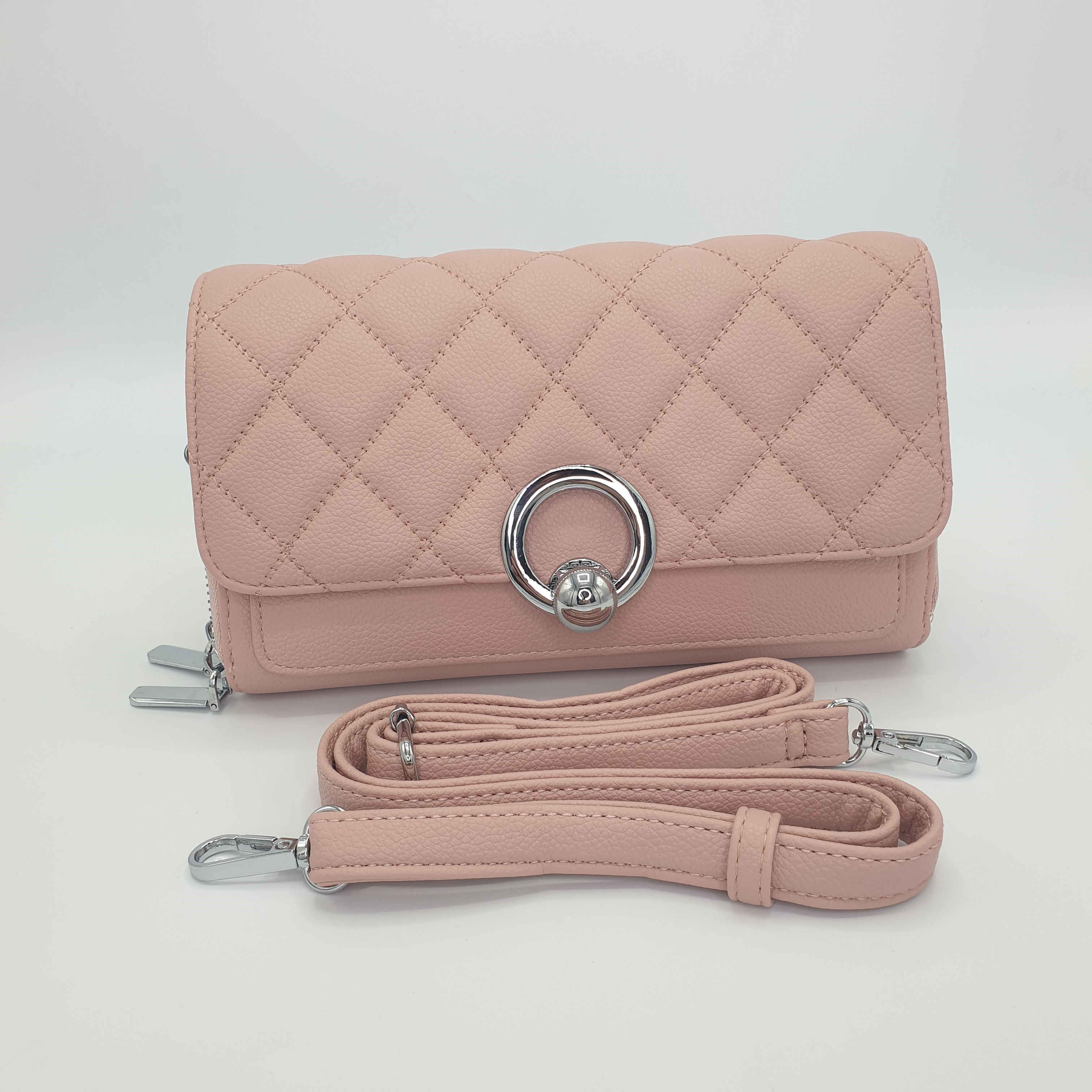 The Coco pink quilted cross body bag with detachable strap