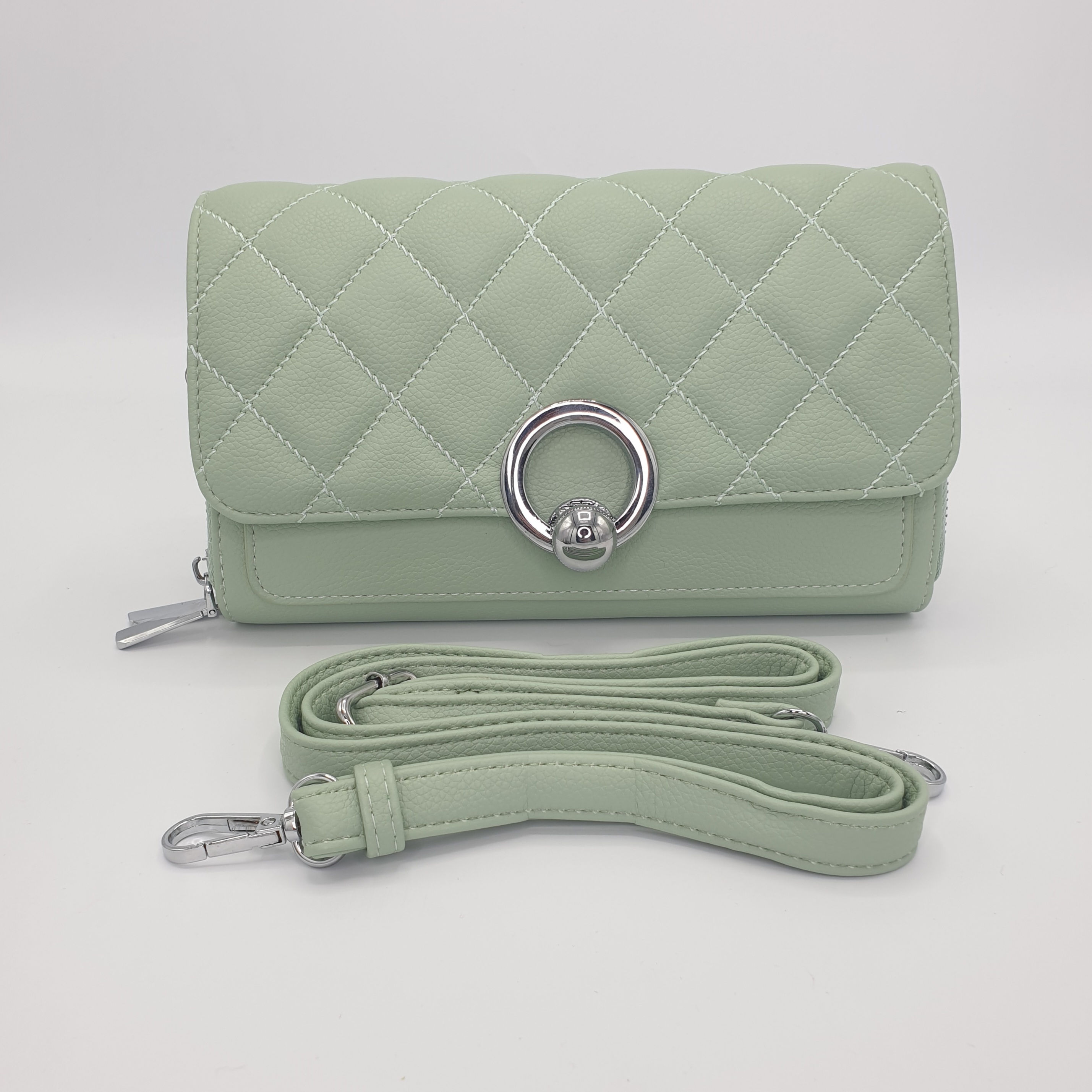 The Coco green quilted cross body bag with detachable strap