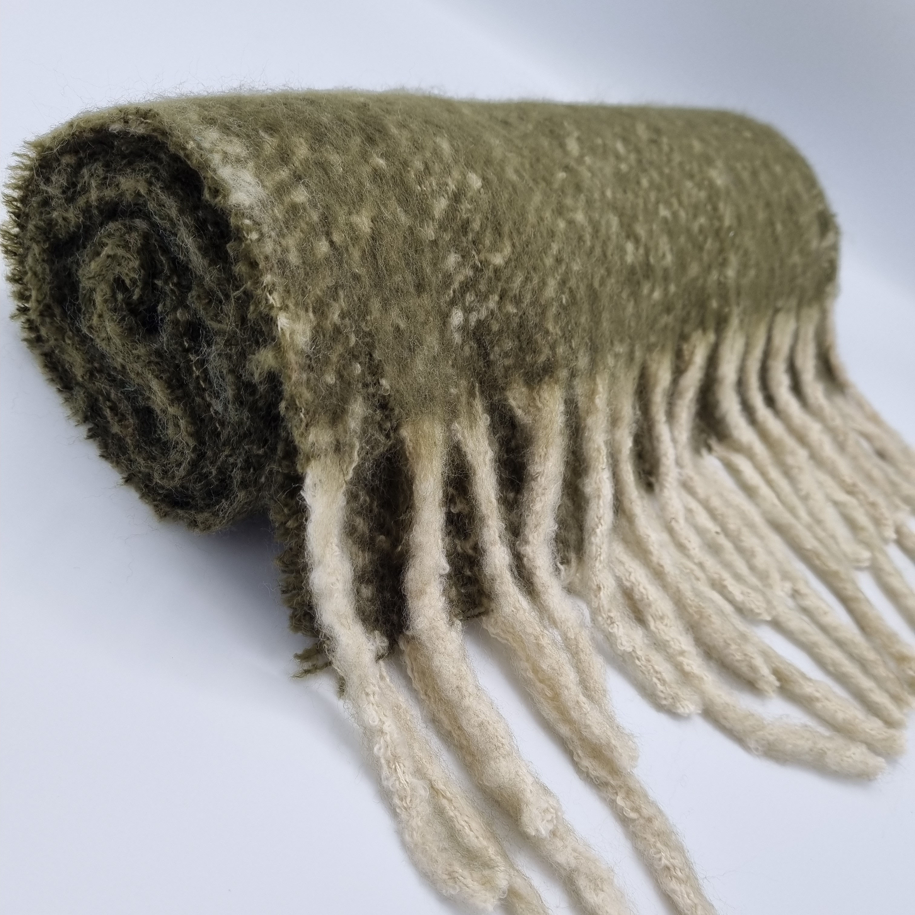 Soft, fluffy tassle scarf in juniper green