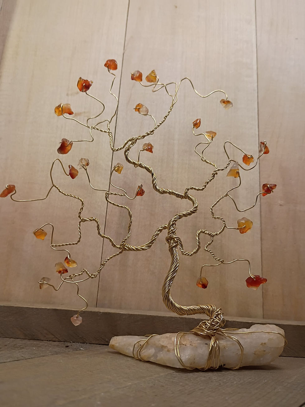 "This was one of our earliest crystal tree prototypes. Simple, 2D, and rooted around the stone rather than onto it. We were learning flow, balance, and structure, and falling in love with the process along the way."
