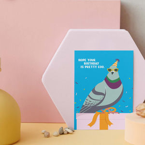 A birthday greeting card in a simplistic vector-style. The card contains a pigeon in a party hat and sunglasses standing on a birthday present with confetti flying around the pigeon. The front of the greeting card reads: "I hope your birthday is pretty coo."