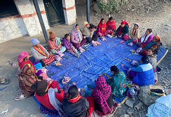 Women Making reuseable pad in outdoor setting of Humla