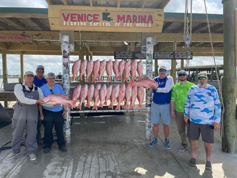 photo of group of people holding fish while fishing with Southern Pro Charters in Venice, Louisiana