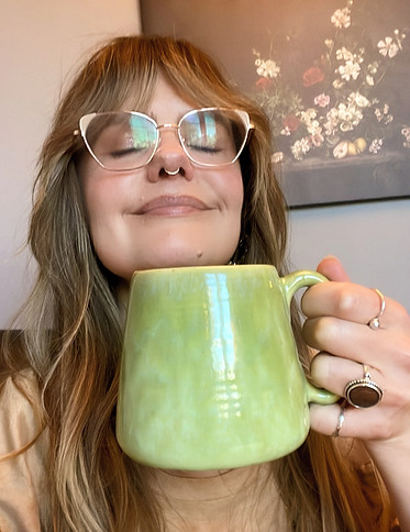 Stephanie holding her favourite green mug