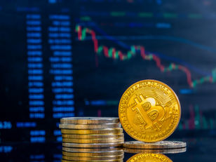 Bitcoin coin on dark background with chart