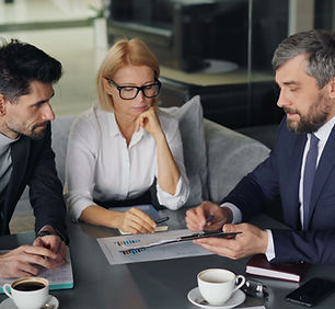 Business professionals evaluating the financial and tax structure of a transaction