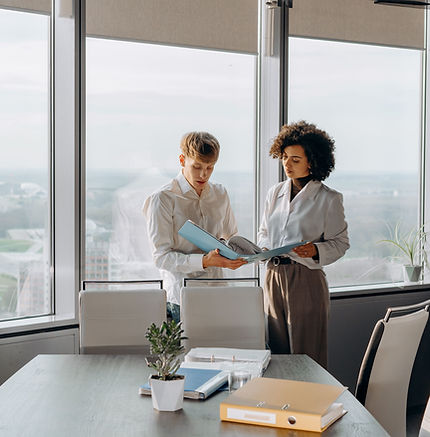 Business professional reviewing financial records for tax preparation and reporting