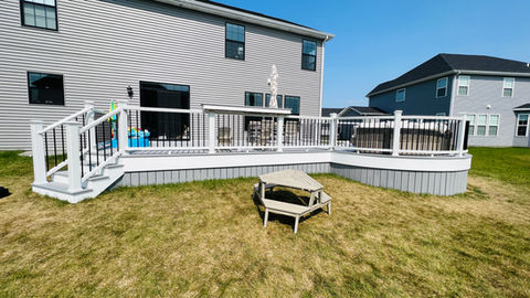 Trex Deck in Grey with White aluminum railings done by professional deck installer in Naperville, IL.