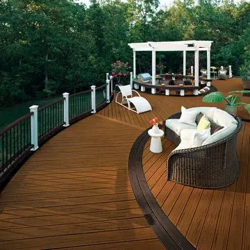 Curved Trex Transcend decking boards bent for custom deck design by your deck company near me.