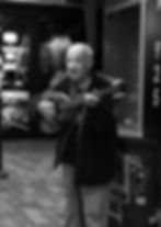 A man playing the Bouzouki.