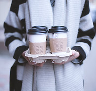 Girl Holding Take-Away Coffee