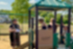 Pastor Ashley with the children on the playground