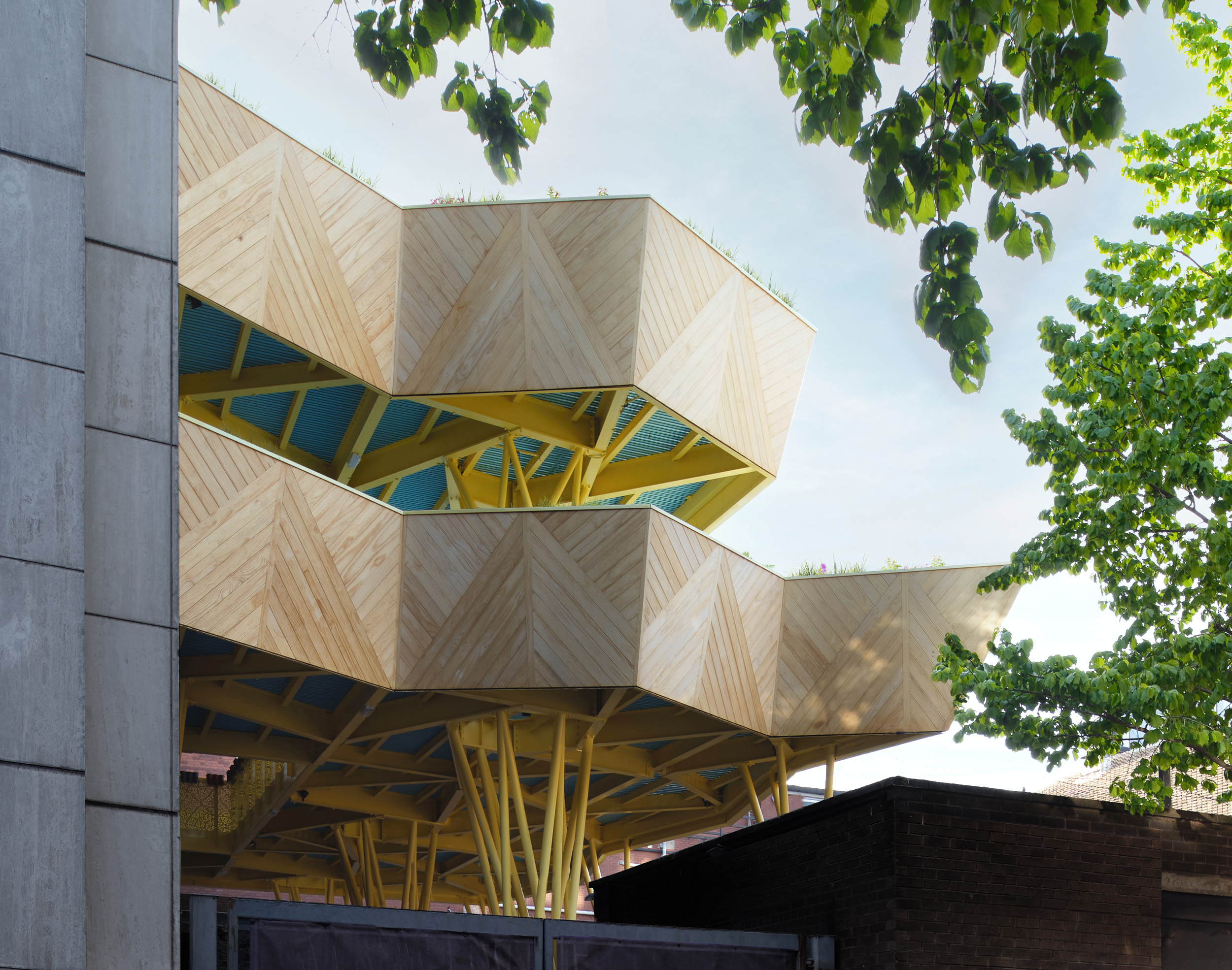 Holt Architecture — An elevated, sculptural terrace transforms a constrained urban rooftop into a green retreat for 600 secondary school students in the heart of East Lon