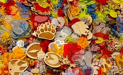 A huge collection of etched and cut out paw prints of various species