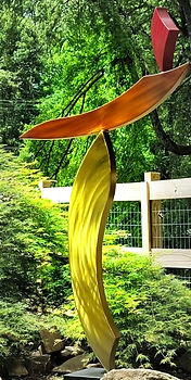 Abstract yellow and orange steel sculpture by metal sculptor Jason Smith