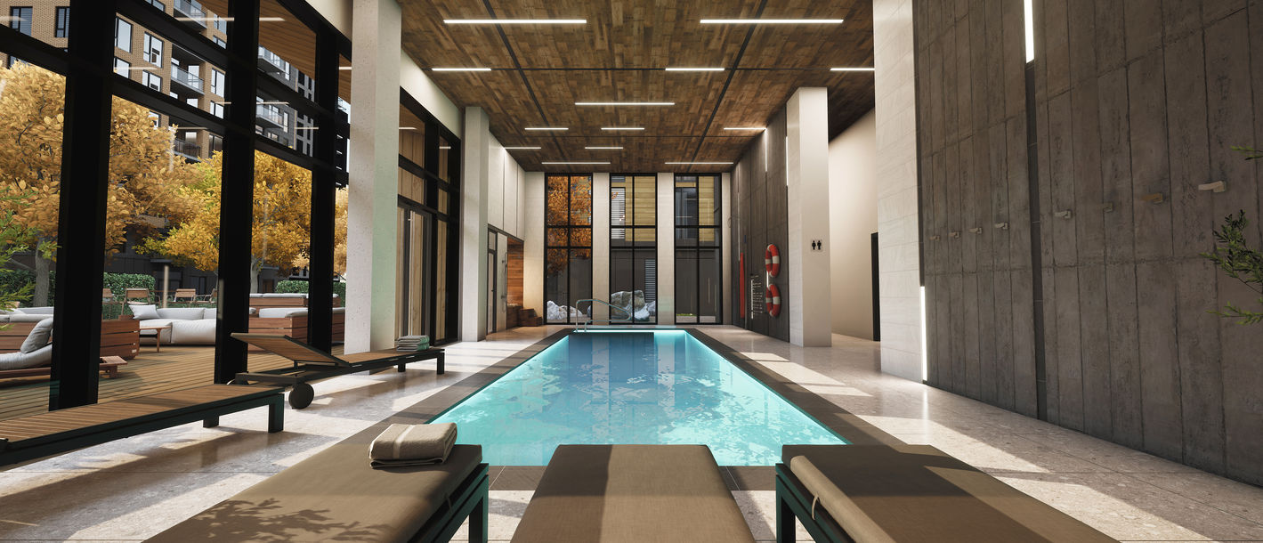 3D rendering of an indoor swimming pool with lounge chairs. 3D rendering design by Tangram Studio.