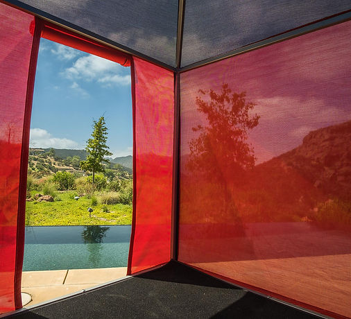 tricolor duodecahedron interior looking out at the landscape