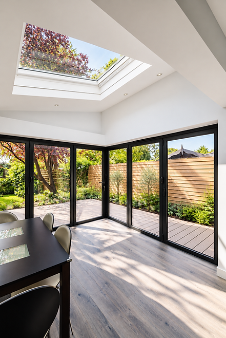 Modern rear extension with corner doors.