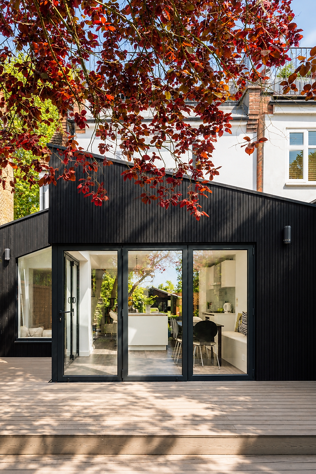 Black timber clad rear extension London.