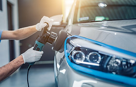 Machine polishing a vehicle’s paint to improve gloss