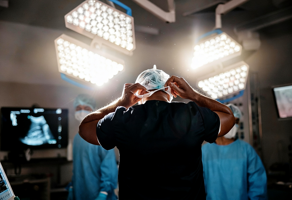 Surgeon preparing for surgery, representing Santosh Jacob's trauma care specialty