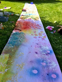 Karen Wallace and WHEAT student artwork outside of SNAC