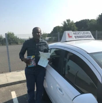 Black man with driving pass certificate.jpg