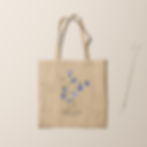 Eco-friendly cotton tote bag featuring a hand-painted blue bellflower botanical illustration with minimalist floral design.