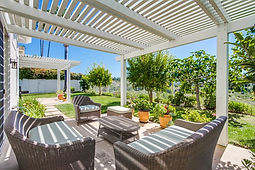 Large Backyard With Trees and Funiture