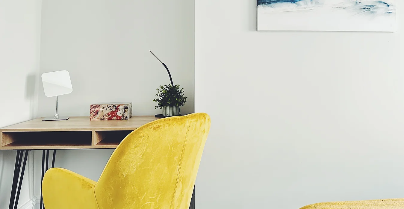 Modern home office featuring a bright yellow work chair from the HG Collection in Cardiff