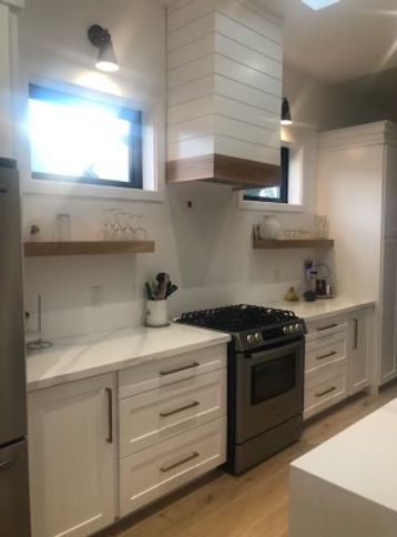 Custom Cabinetry - Kitchen white with floating shelves below 2 windows
