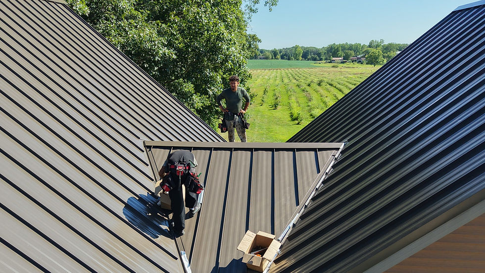 Avilla standing seam metal roof with snow retention, ridge ventilation, and stainless steel gutter guards