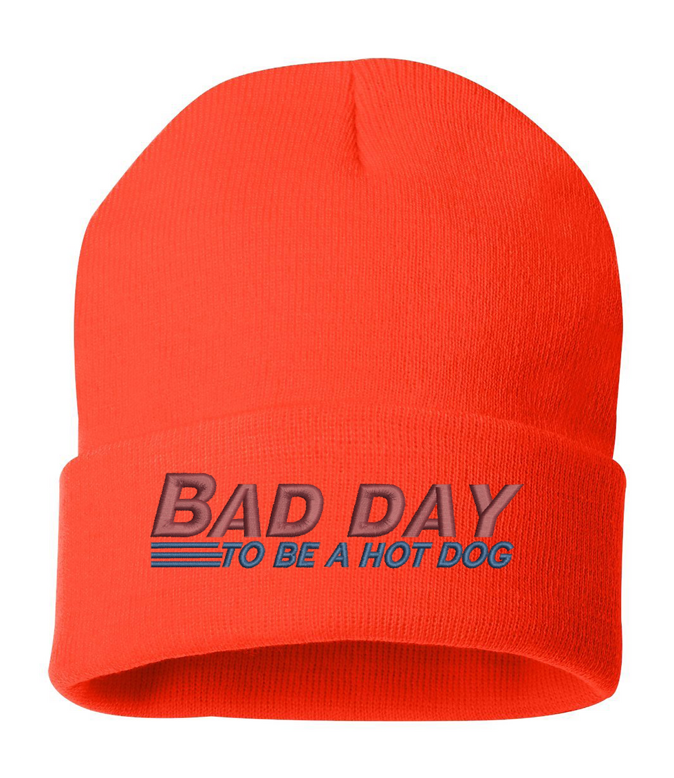 Orange beanie with the text 'Bad Day to Be a Hot Dog' in blue and pink lettering.