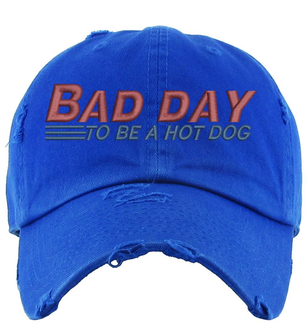 Blue distressed baseball cap with the text 'Bad Day To Be A Hot Dog' embroidered on it.
