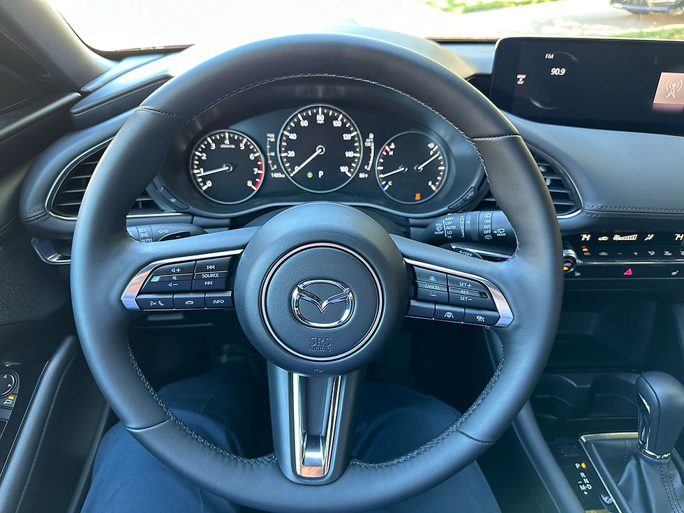 2024 Mazda 3 2.5T Hatchback steering wheel and instrument cluster