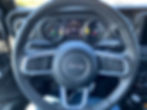 2021 Jeep Wrangler Unlimited Sahara 4XE steering wheel and gauge cluster