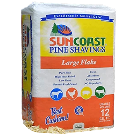 Bag of SunCoast Pine Shavings with colorful text and animal icons. Highlights include "Large Flake" and "Best Cushion!" on a white background.