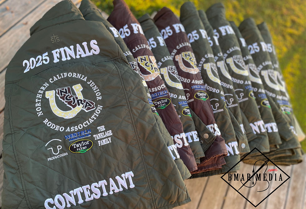 Seven jackets with "2025 Finals," Northern California Junior Rodeo Association logos, and sponsor names are displayed on a wooden surface. Photo by Brianna Lester