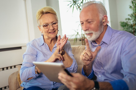 Smiling deaf senior couple talking using