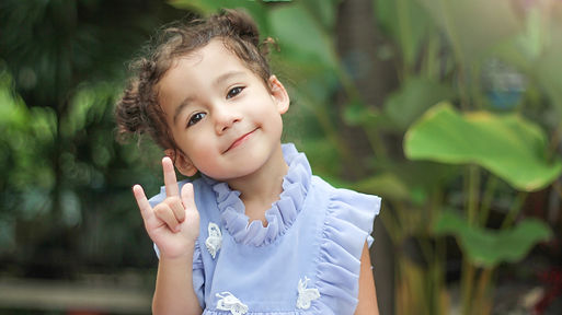 Portrait of a cute little girl smiling w