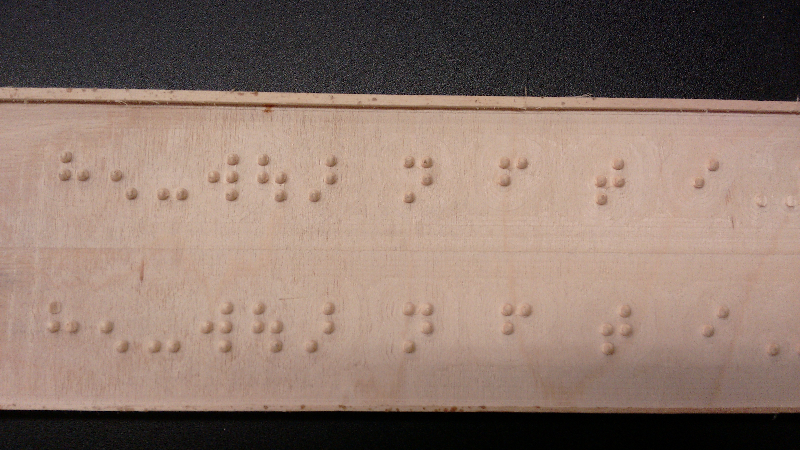 Braile Letters on Solid Mahagony