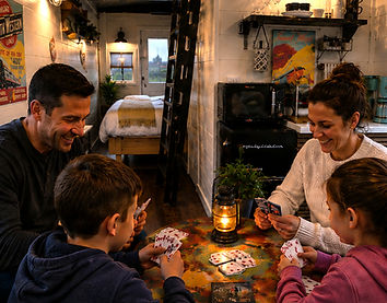 a family playing cards inside of the caboose