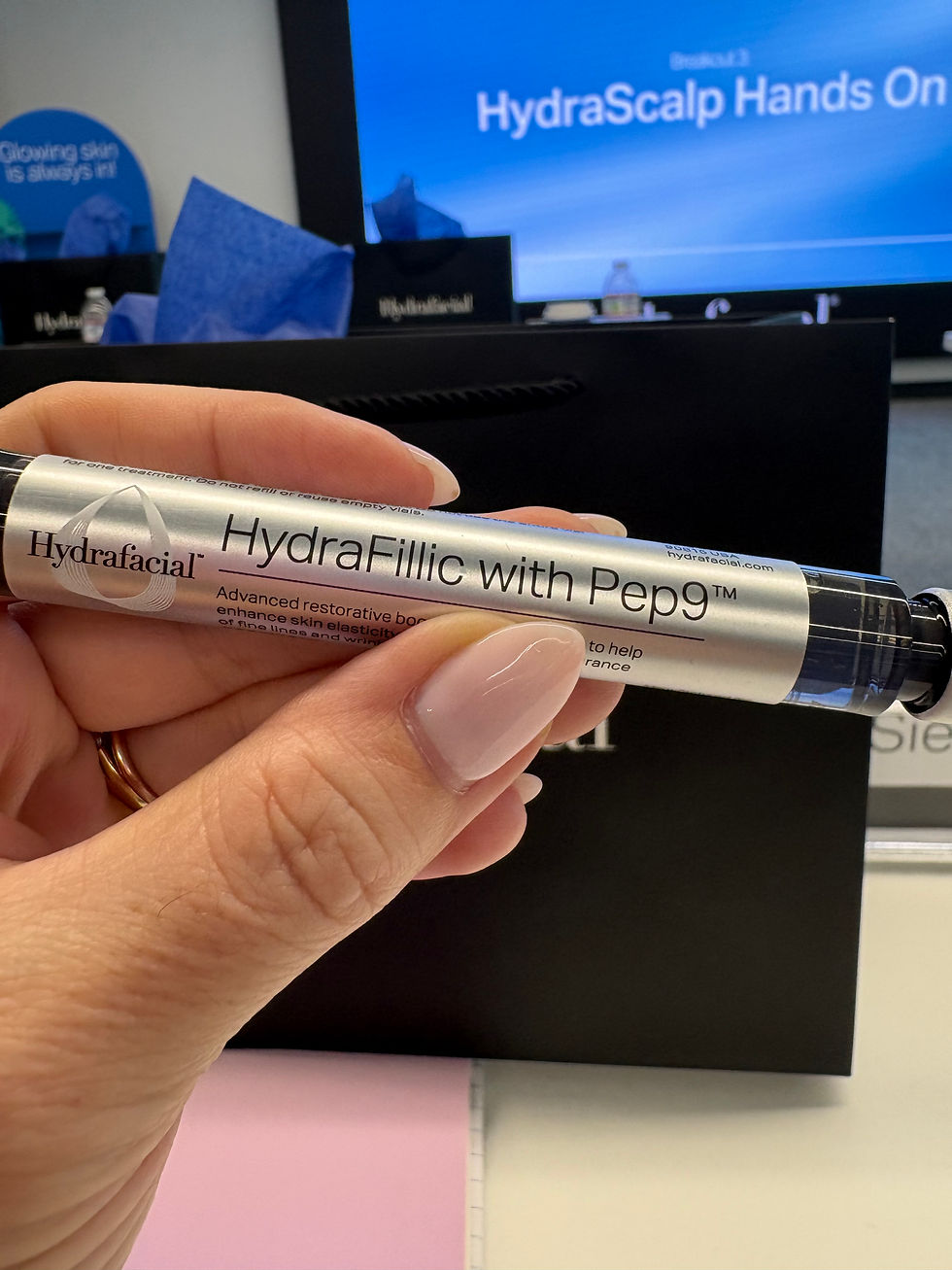HydraFillic with Pep9 booster used during a HydraFacial treatment to improve hydration, elasticity, and skin firmness.