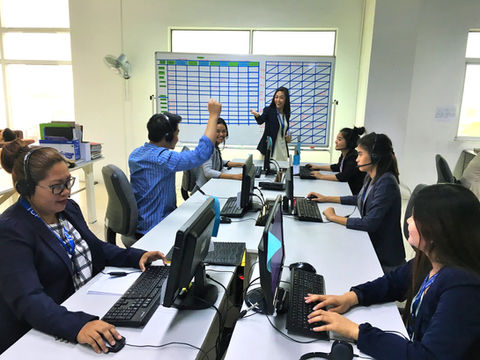 Happy Upsell Technologies Philippines, Inc. team celebrating a successful appointment setting in their Cebu office.