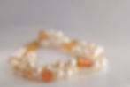 Double strand bracelet with natural Akoya pearls, natural precious topaz, and a 14ky gold pearl clasp.
